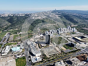 Aerial view of buildings on Har Hotzvim mountain peak and Jerusalem cityscape in Israel