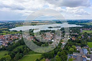 Aerial View of buildings and the mere in the seaside town of Hornsea during Summer of 2019