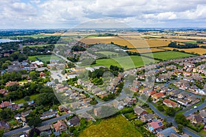 Aerial View of buildings and the mere in the seaside town of Hornsea during Summer of 2019