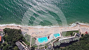 aerial view of Bulgaria's Golden Sands resort during the summer season: an array of hotels, pools, and crowds of