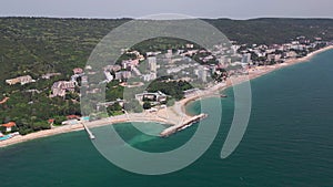 aerial view of Bulgaria's Golden Sands resort during the summer season: an array of hotels, pools, and crowds of