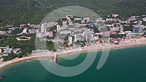 aerial view of Bulgaria's Golden Sands resort during the summer season: an array of hotels, pools, and crowds of