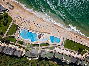 aerial view of Bulgaria's Golden Sands resort during the summer season: an array of hotels, pools, and crowds of