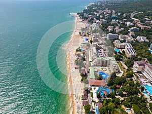 aerial view of Bulgaria's Golden Sands resort during the summer season: an array of hotels, pools, and crowds of