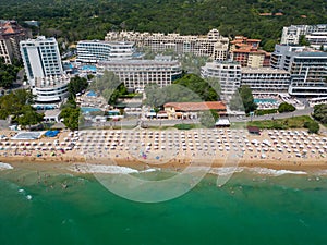 aerial view of Bulgaria's Golden Sands resort during the summer season: an array of hotels, pools, and crowds of