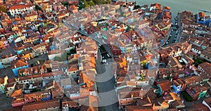 Aerial view of Burano colorful houses, along the Fondamenta embankment, Italy