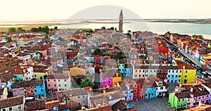 Aerial view of Burano Island, colorful houses, Church and Campanile, Italy