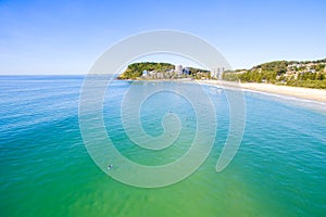 An aerial view of Burleigh Beach on a clear day with blue water