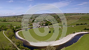 Aerial view of Burnsall, and its well known bridge in Wharfedale, Yorkshire Dales National Park, North Yorkshire, England, Britain