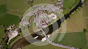 Aerial view of Burnsall, and its well known bridge in Wharfedale, Yorkshire Dales National Park, North Yorkshire, England, Britain