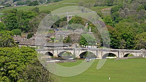 Aerial view of Burnsall, and its well known bridge in Wharfedale, Yorkshire Dales National Park, North Yorkshire, England, Britain