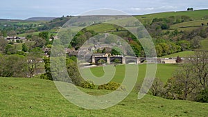 Aerial view of Burnsall, and its well known bridge in Wharfedale, Yorkshire Dales National Park, North Yorkshire, England, Britain