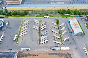 Aerial view of bus parking lot. Buses parking near bus transport company