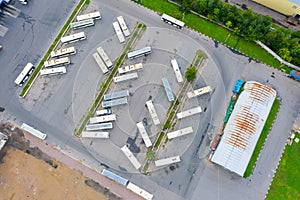 Aerial view of bus parking lot. Buses parking near bus transport company