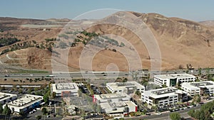 Aerial view of business buildings and freeway in Calabasas, California