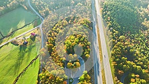 Aerial view of busy American freeway with fast moving cars and trucks. Interstate hauling of goods concept