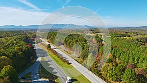 Aerial view of busy american highway with fast moving traffic. Interstate transportation concept