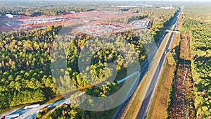 Aerial view of busy american highway with fast moving traffic. Interstate transportation concept