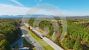 Aerial view of busy American highway with fast moving traffic. Interstate transportation concept