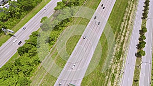 Aerial view of busy american highway with heavy fast moving traffic. Interstate transportation concept