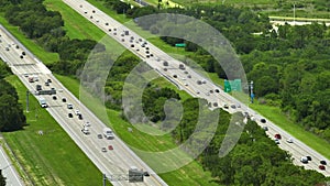 Aerial view of busy american highway with heavy fast moving traffic. Interstate transportation concept