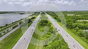 Aerial view of busy american highway with heavy fast moving traffic. Interstate transportation concept