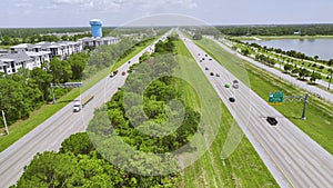 Aerial view of busy american highway with heavy fast moving traffic. Interstate transportation concept