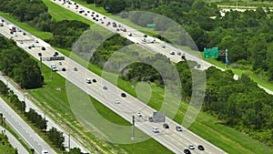 Aerial view of busy american highway with heavy fast moving traffic. Interstate transportation concept