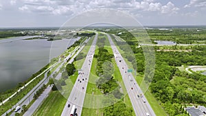 Aerial view of busy american highway with heavy fast moving traffic. Interstate transportation concept