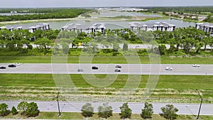 Aerial view of busy american highway with heavy fast moving traffic. Interstate transportation concept