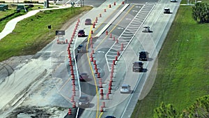 Aerial view of busy american highway road under construction. Development of traffic infrastructure. Interstate