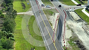 Aerial view of busy american highway road under construction. Development of traffic infrastructure. Interstate