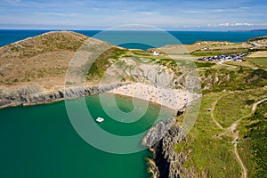 Aerial view of a busy beach and bay in West Wales Mwnt, Ceredigion