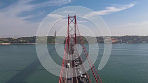 Aerial view of busy car traffic across famous red Ponte 25 de Abril bridge in Lisbon, Portugal