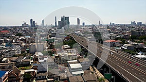 Aerial view of busy cars with traffic jam in the rush hour on highway road street on bridge in Bangkok Downtown, urban