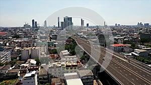 Aerial view of busy cars with traffic jam in the rush hour on highway road street on bridge in Bangkok Downtown, urban