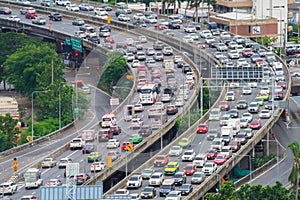 Aerial view of busy cars with traffic jam in the rush hour on highway road street on bridge in Bangkok Downtown, urban city in