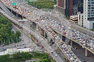 Aerial view of busy cars with traffic jam in the rush hour on highway road street on bridge in Bangkok Downtown, urban city in