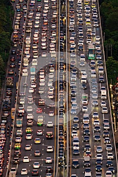 Aerial view of busy cars with traffic jam in the rush hour on highway road street on bridge in Bangkok Downtown, urban city in