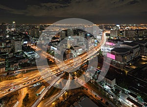 Aerial view of busy cars with traffic jam in the rush hour on highway road street on bridge in Bangkok Downtown, urban city in