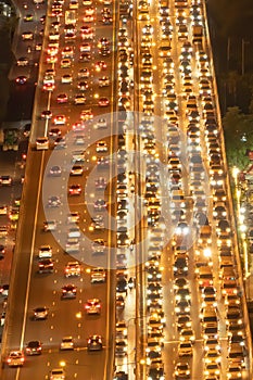 Aerial view of busy cars with traffic jam in the rush hour on highway road street on bridge in Bangkok Downtown, urban city in