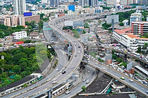 Aerial view of busy cars with traffic jam in the rush hour on highway road street on bridge in Bangkok Downtown, urban city in