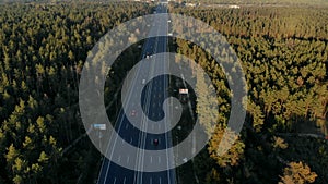 Aerial view of busy highway surrounded by forest