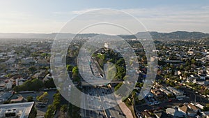 Aerial view of busy multilane freeway leading through residential urban boroughs. Los Angeles, California, USA