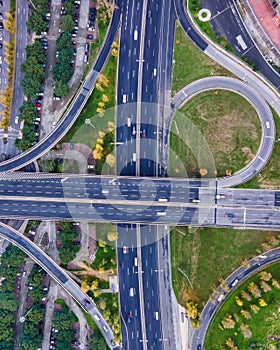 Aerial view of a busy road intersection with vehicles driving along Benfica Soccer stadium in Benfica district at twilight, Lisbon