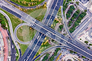 Aerial view of a busy road intersection with vehicles driving along Benfica Soccer stadium in Benfica district at twilight, Lisbon