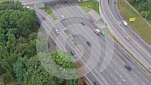Aerial view of busy road junction, car traffic, rush hour