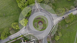 Aerial view of busy traffic roundabout with camera rotation