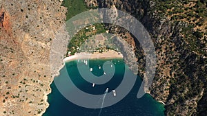 Aerial view of Butterfly Valley in Oludeniz, Turkey. A mediterranean sea and beach between high cliffs