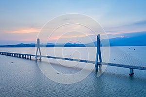 Aerial view of cable-stayed bridge at dusk